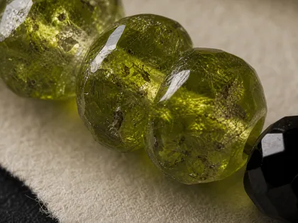 Pakistan peridot, black spinel, sardonyx, and one antique-brass signature detail close detail